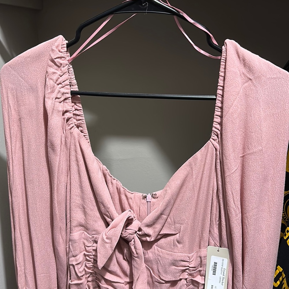 Pink bodycon dress with zipper back, ruching in the front, tie neckline